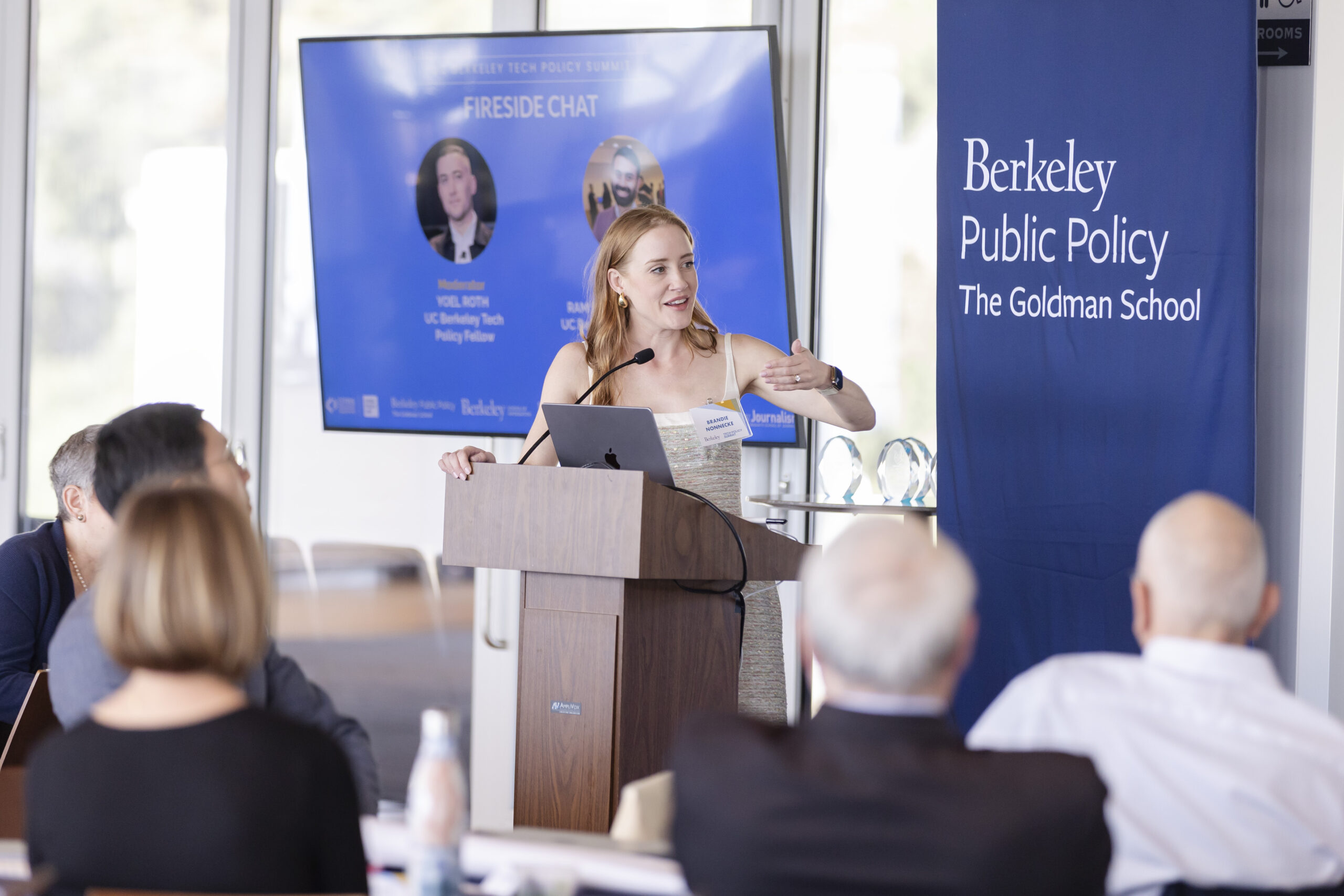 Brandie Nonnecke, the founding director of the CITRIS Policy Lab, speaks at a podium during an event.